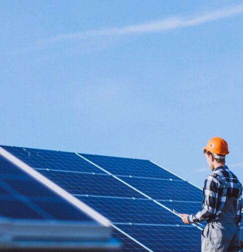 Man Worker Firld By Solar Panels 483x501